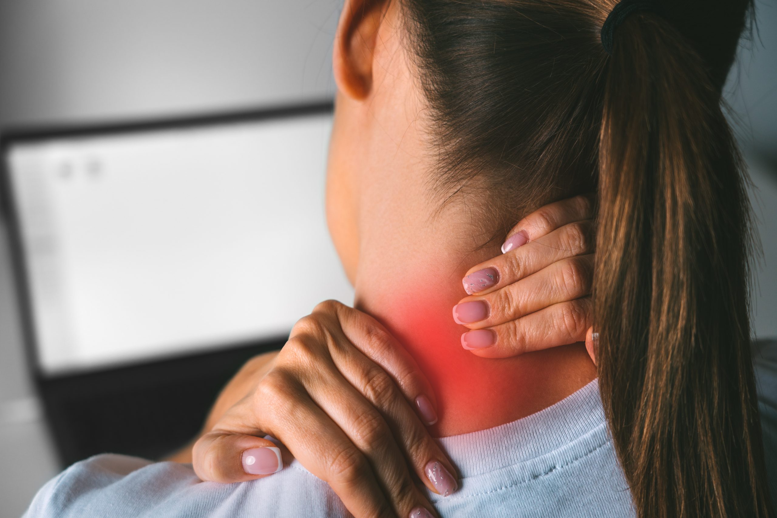 neck-pain-after-working-on-computer-young-woman-massaging-neck-to-relieve-pain-after-working-on-pc